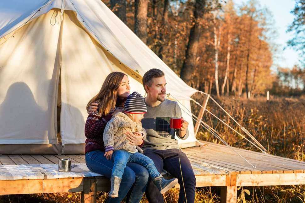Young family camping outdoors