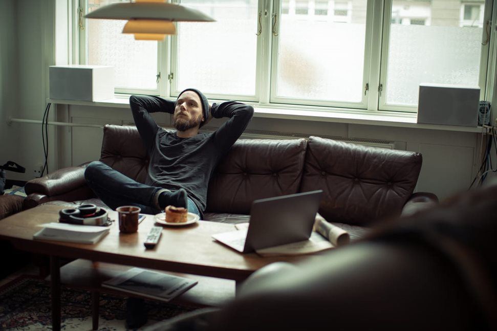 Worried man sitting on couch