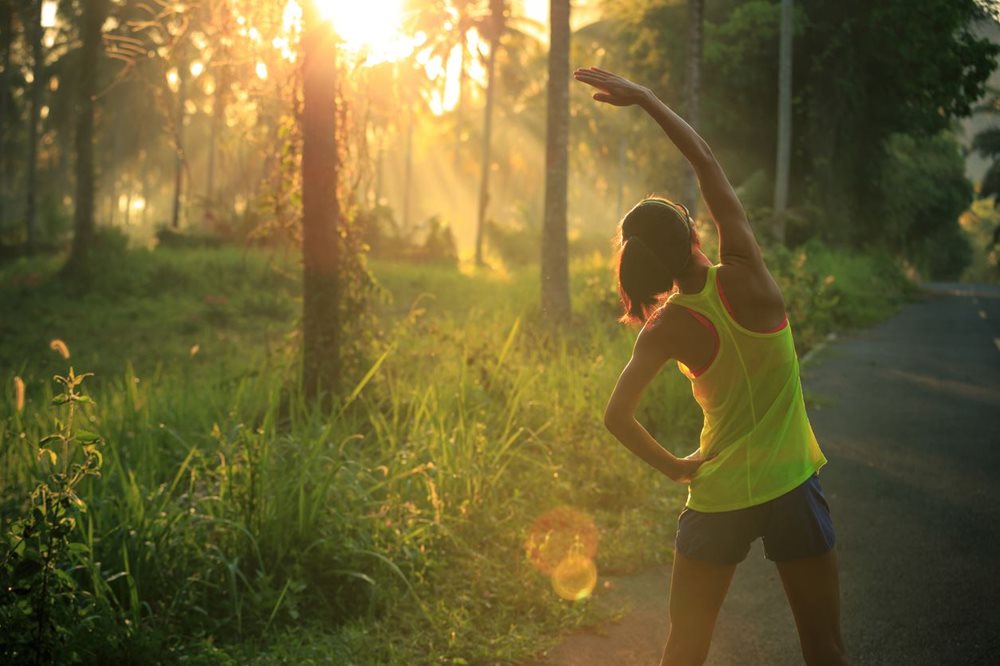 woman exercising in a forest